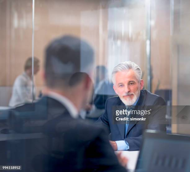 business people in meeting room - blue blazer stock pictures, royalty-free photos & images