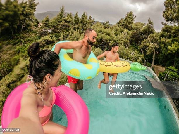 swimming pool jump - donut man stock pictures, royalty-free photos & images