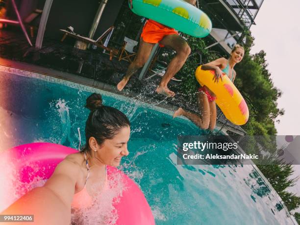 swimming pool jump - woman shooting pool stock pictures, royalty-free photos & images