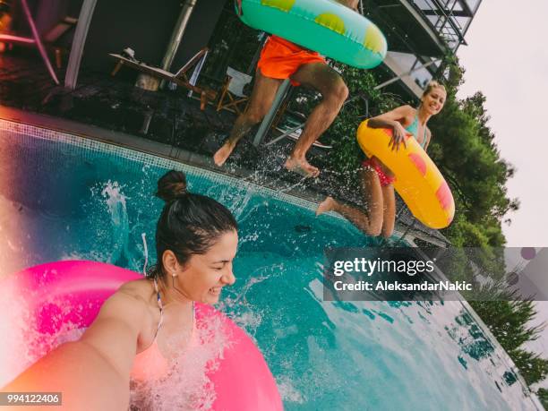 swimming pool jump - friends donut stock pictures, royalty-free photos & images