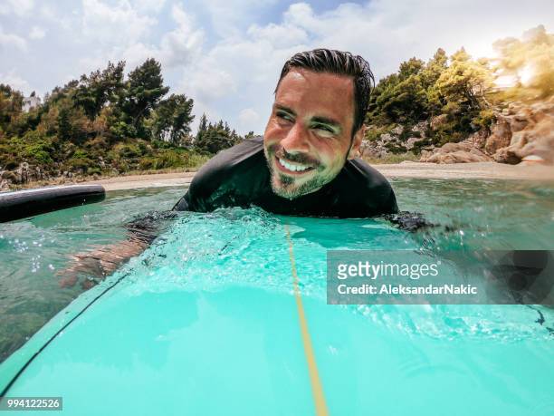 surfer in action - action camera stock pictures, royalty-free photos & images
