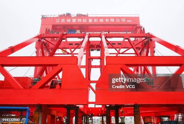 Ton girder launcher to erect the No.28 main pier of the Hutong Yangtze River Bridge is seen at a crane manufacturing base on July 5, 2018 in Nantong,...