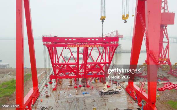 Ton girder launcher to erect the No.28 main pier of the Hutong Yangtze River Bridge is seen at a crane manufacturing base on July 5, 2018 in Nantong,...