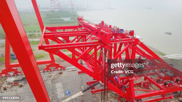 Ton girder launcher to erect the No.28 main pier of the Hutong Yangtze River Bridge is seen at a crane manufacturing base on July 5, 2018 in Nantong,...