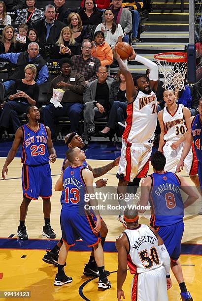 Ronny Turiaf of the Golden State Warriors dunks against Sergio Rodriguez and Danilo Gallinari of the New York Knicks during the game at Oracle Arena...