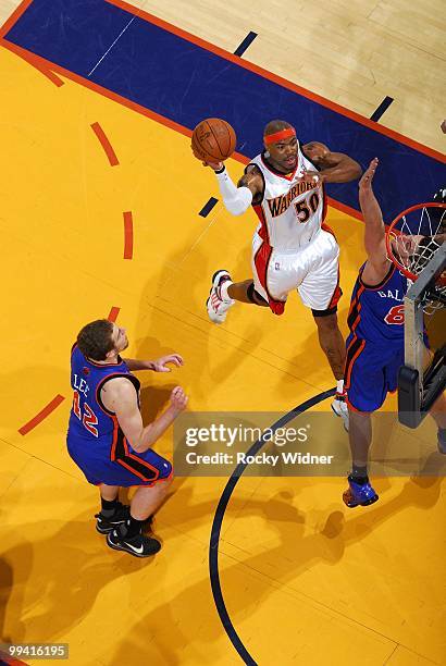 Corey Maggette of the Golden State Warriors goes up for a shot against David Lee and Danilo Gallinari of the New York Knicks during the game at...