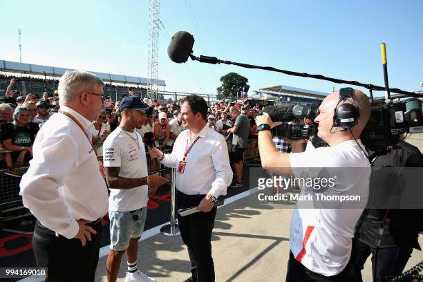 Lewis Hamilton of Great Britain and Mercedes GP and Ross Brawn, Managing Director of the Formula One Group are interviewed during the launch of the...