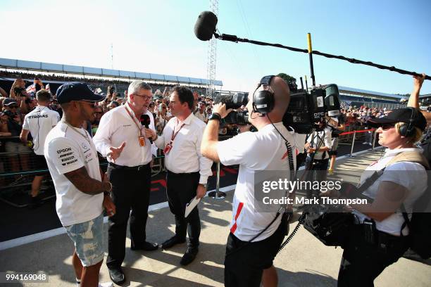 Lewis Hamilton of Great Britain and Mercedes GP and Ross Brawn, Managing Director of the Formula One Group are interviewed during the launch of the...