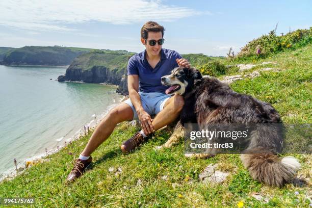 single brazilian man lifestyle portrait at beach - dyfed stock pictures, royalty-free photos & images