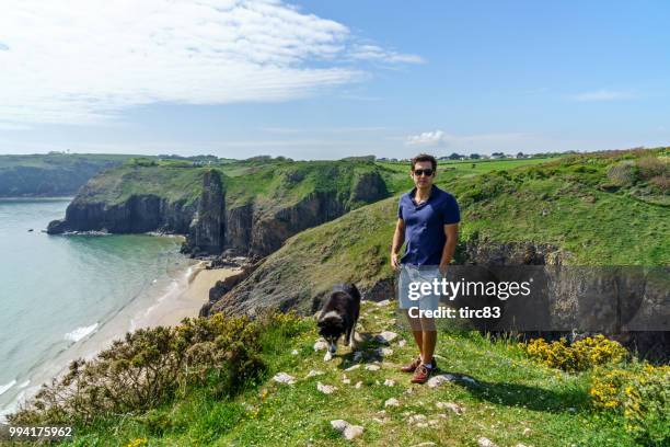 single brazilian man lifestyle portrait at beach - dyfed stock pictures, royalty-free photos & images