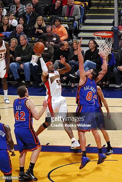 Corey Maggette of the Golden State Warriors goes up for a shot against David Lee and Danilo Gallinari of the New York Knicks during the game at...