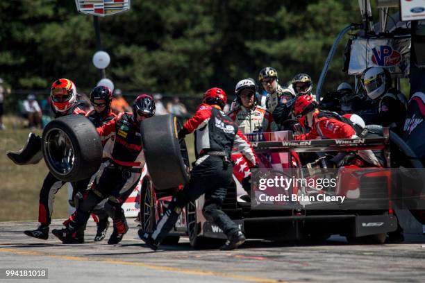 The Cadillac DPi of Eric Curran and Felipe Nasr, of Portugal, makes a pit stop during the IMSA WeatherTech race at Canadian Tire Motorsport Park on...