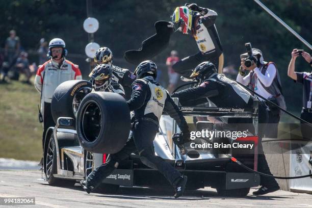 The Cadillac DPi of Christian Fittipaldi, of Brazil, and Felipe Albuquerque, of Portugal, makes a pit stop during the IMSA WeatherTech race at...