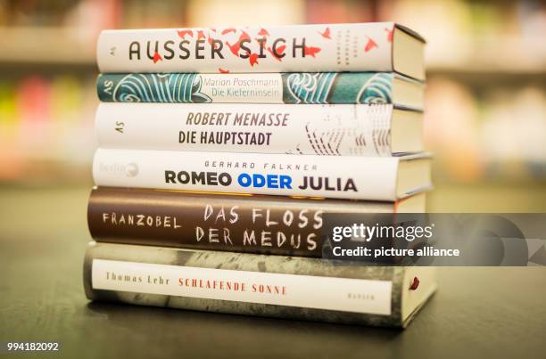 Six books that made the shortlist for the German Book Prize can be seen in a book store in Stuttgart, Germany, 12 September 2017. From top to bottom:...