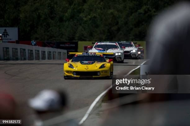 The Corvette C7.R of Oliver Gavin, of Great Britain, and Tommy Milner races on the track during the IMSA WeatherTech race at Canadian Tire Motorsport...