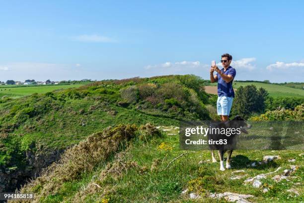 single brazilian man lifestyle portrait at beach - dyfed stock pictures, royalty-free photos & images