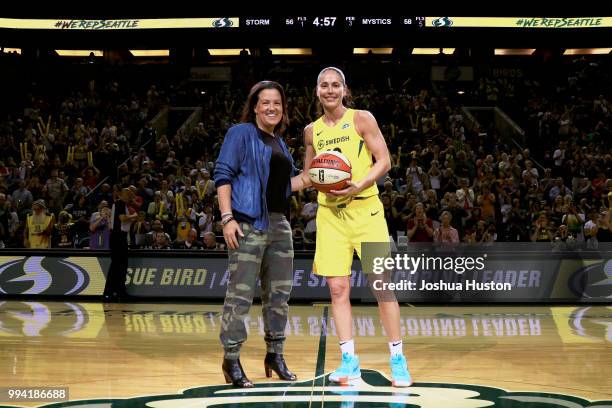President and General Manager Alisha Valavanis of the Seattle Storm is photographed with Sue Bird as she becomes the all-time leader in points for...