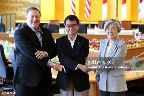 Secretary of State Mike Pompeo, South Korean Foreign Minister Kang Kyung-wha and Japanese Foreign Minister Taro Kono pose for photographs during the...