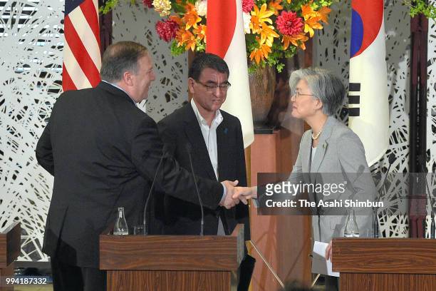 Secretary of State Mike Pompeo, South Korean Foreign Minister Kang Kyung-wha and Japanese Foreign Minister Taro Kono shake hands after a joint press...