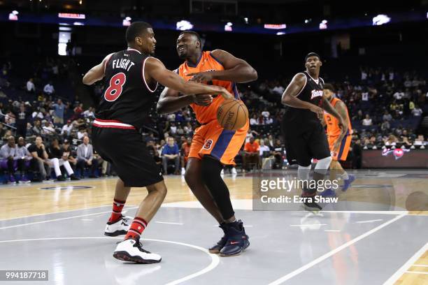 James White of Trilogy defends Jason Maxiell of 3's Company during week three of the BIG3 three on three basketball league game at ORACLE Arena on...