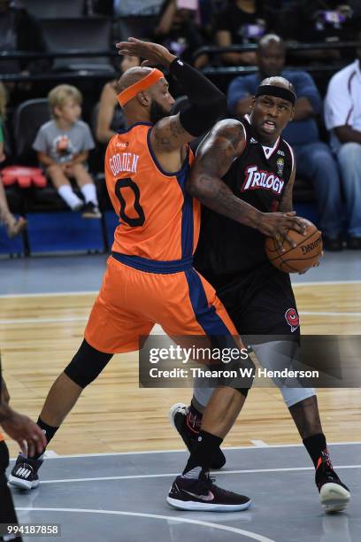 Al Harrington of Trilogy is defended by Drew Gooden of 3's Company during week three of the BIG3 three on three basketball league game at ORACLE...