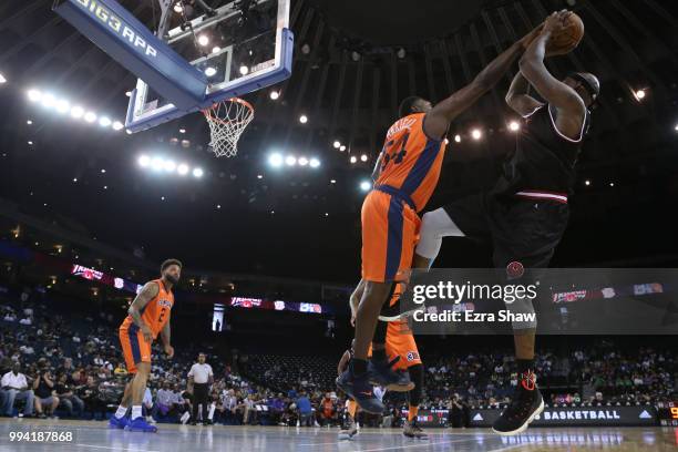 Jason Maxiell of 3's Company blocks a shot from Al Harrington of Trilogy during week three of the BIG3 three on three basketball league game at...