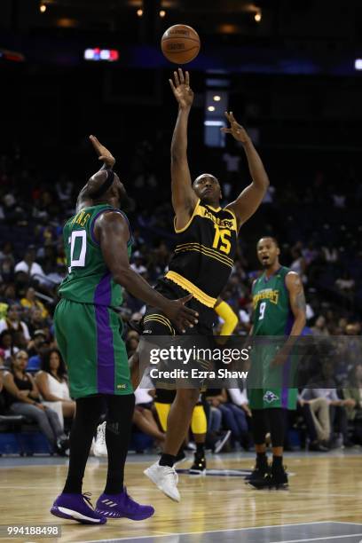 Metta World Peace of Killer 3s shoots against Reggie Evans of 3 Headed Monsters during week three of the BIG3 three on three basketball league game...