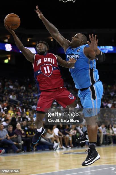 Nate Robinson of Tri State goes up for a shot against Glen Davis of Power during week three of the BIG3 three on three basketball league game at...