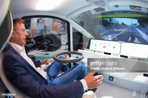 Hannes Roth presents how to control a car via gestures at the stand of Harman, an exhibitor at the 'New Mobility World' at the International...