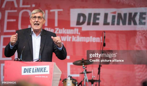 Bernd Riexinger, chairman of Die Linke party, speaks at an election campaign event of his party on the Castle Square in Stuttgart, Germany, 12...