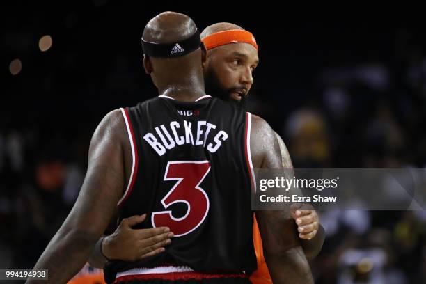 Drew Gooden of 3's Company hugs Al Harrington of Trilogy during week three of the BIG3 three on three basketball league game at ORACLE Arena on July...