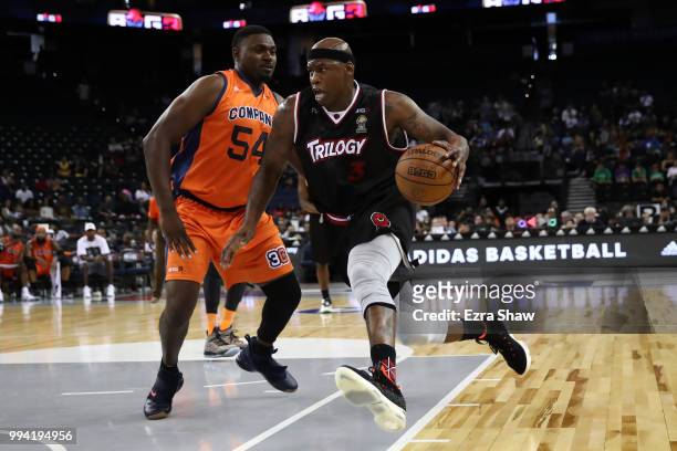 Al Harrington of Trilogy drives with the ball against Jason Maxiell of 3's Company during week three of the BIG3 three on three basketball league...