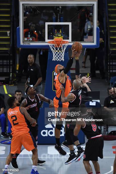 Drew Gooden of 3's Company defends a shot by Dahntay Jones of Trilogy during week three of the BIG3 three on three basketball league game at ORACLE...