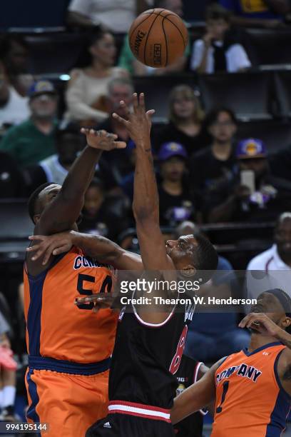 Jason Maxiell of 3's Company blocks a shot by James White of Trilogy during week three of the BIG3 three on three basketball league game at ORACLE...