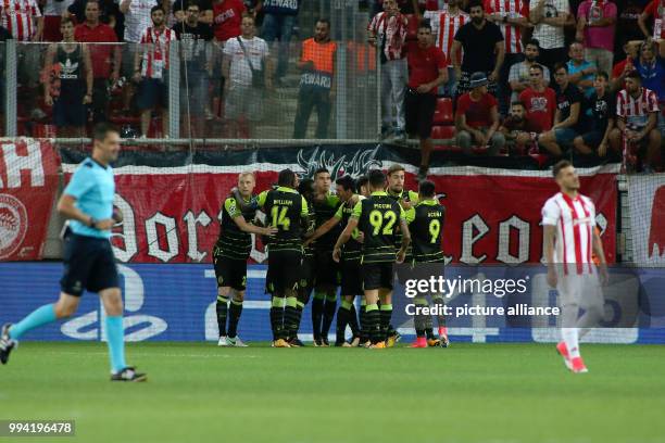 Sporting Lisbon' Seydou Doumbia celebrates after scoring during a Group D, UEFA Champions League football match between Olympiacos and Sporting...