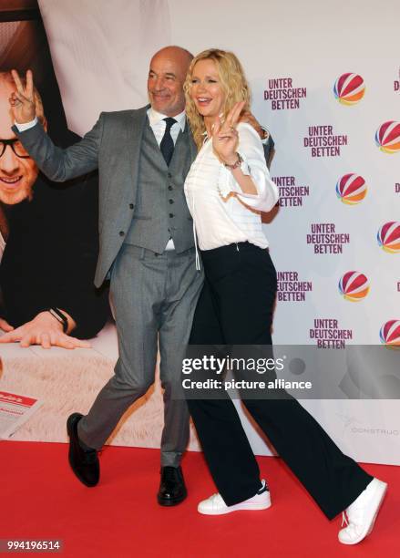 Actors Heiner Lauterbach and Veronica Ferres arrive at the movie premiere of 'Unter deutschen Betten' at the Mathaeser Filmpalast in Munich, Germany,...