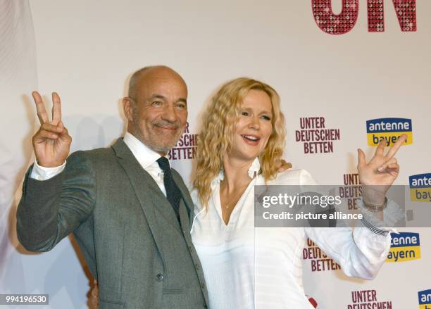 Actors Heiner Lauterbach and Veronica Ferres arrive at the movie premiere of 'Unter deutschen Betten' at the Mathaeser Filmpalast in Munich, Germany,...