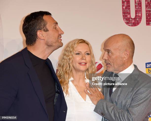 Boxer Wladimir Klitschko and actors Veronica Ferres and Heiner Lauterbach arrive at the movie premiere of 'Unter deutschen Betten' at the Mathaeser...