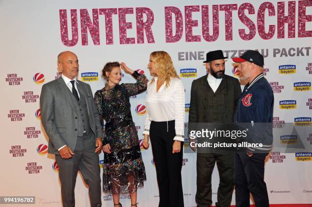 Actors Heiner Lauterbach , Magdalena Boczarska, Veronica Ferres, Eray Eglimez and Simon Schwarz arrive at the movie premiere of 'Unter deutschen...