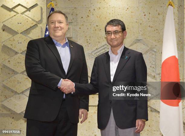 Secretary of State Mike Pompeo and Japanese Foreign Minister Taro Kono shake hands ahead of a breakfast meeting at the Imperial Hotel in Tokyo on...