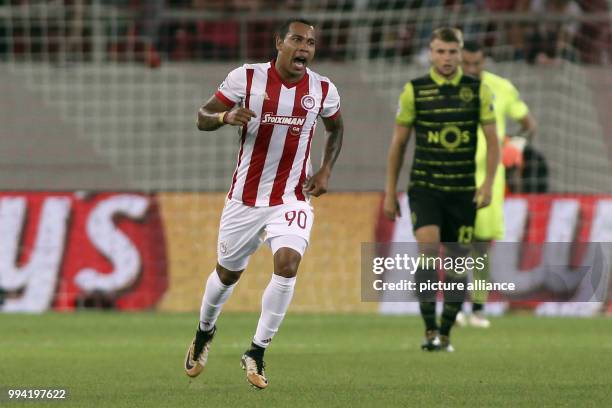 Piraeu's Felipe Pardo celebrates his goal during a Group D, UEFA Champions League football match between Olympiacos and Sporting Lisbon at the...