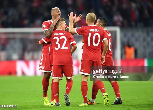 Muenchen's Jerome Boateng , Joshua Kimmich Arjen Robben and Thiago celebrate Kimmich's 3-0 goal during the Champions League Group B match between...