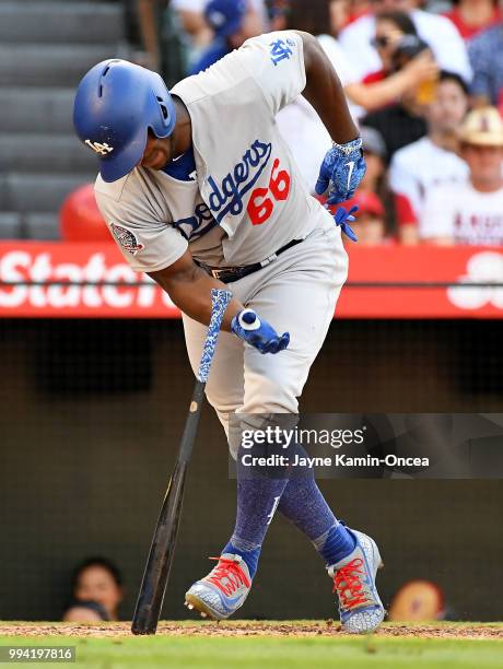 Yasiel Puig of the Los Angeles Dodgers sustains a right intercostal oblique strain in the fifth inning, forcing him to leave the game against the Los...