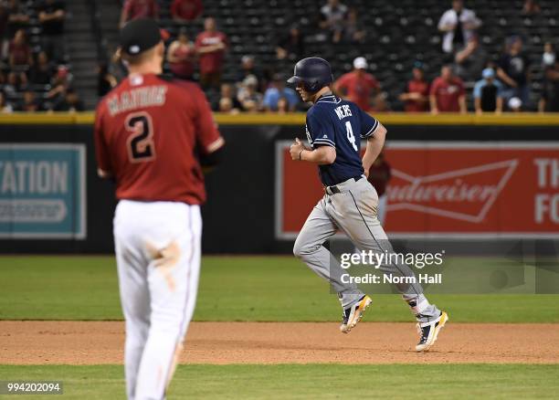 Wil Myers of the San Diego Padres rounds the bases after hitting a solo home run during the sixteenth inning off of Jeff Mathis of the Arizona...