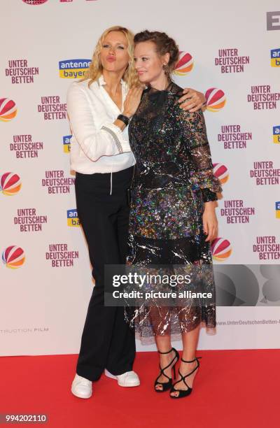 The actresses Veronica Ferres and Magdalena Boczarska attend the film premiere 'Unter deutschen Betten' at the Mathaeser Film Palace in Munich,...