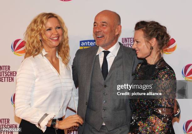 The actors Veronica Ferres , Heiner Lauterbach and Magdalena Boczarska attend the film premiere 'Unter deutschen Betten' at the Mathaeser Film Palace...