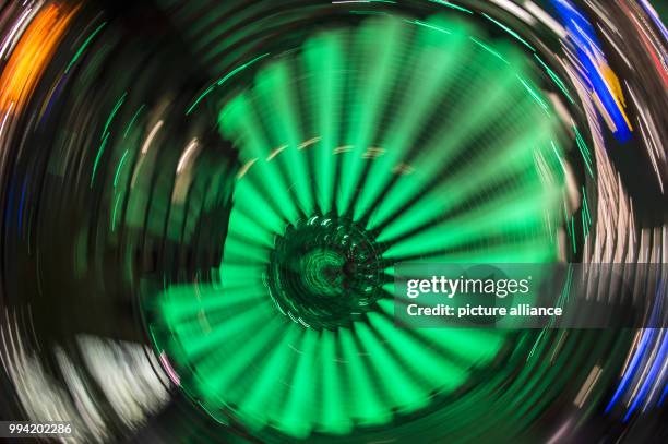 The roof of the Sony Center is illuminated in green in the evening in Berlin, Germany, 12 September 2017. The visitors can gaze at the different...