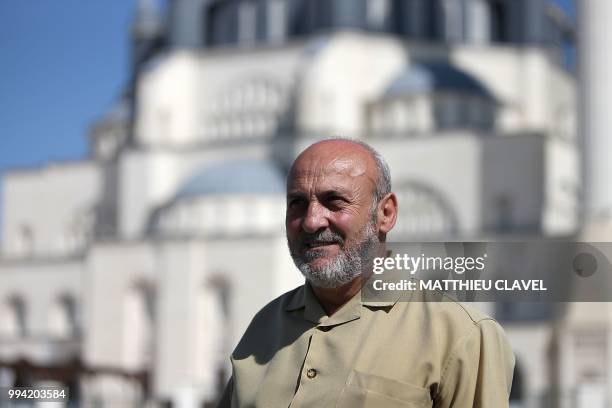 Sixty years old Ayhan Ankurt, who campaigned to get the mosque built, poses during an interview in front of Hala Sultan mosque in Haspolat , in the...