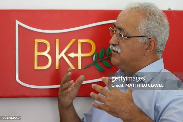 Former member of parliament and founder of the socialist United Cyprus Party Izzet Izcan speaks during an interview at his party's headquarters in...