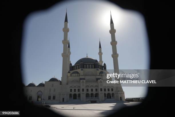 This picture shows the Hala sultan mosque in Haspolat , in the self-proclaimed Turkish Republic of Northern Cyprus , on July 5, 2018. - In the flat...